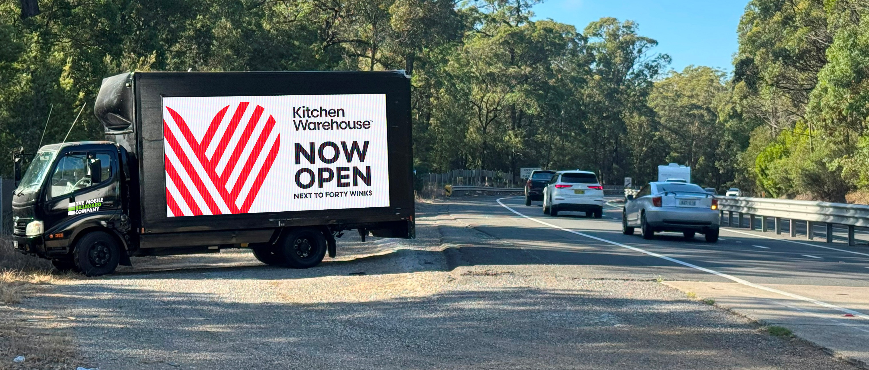 Kitchen Warehouse mobile billboard on Sydney suburban road targeting local homeowners and families
